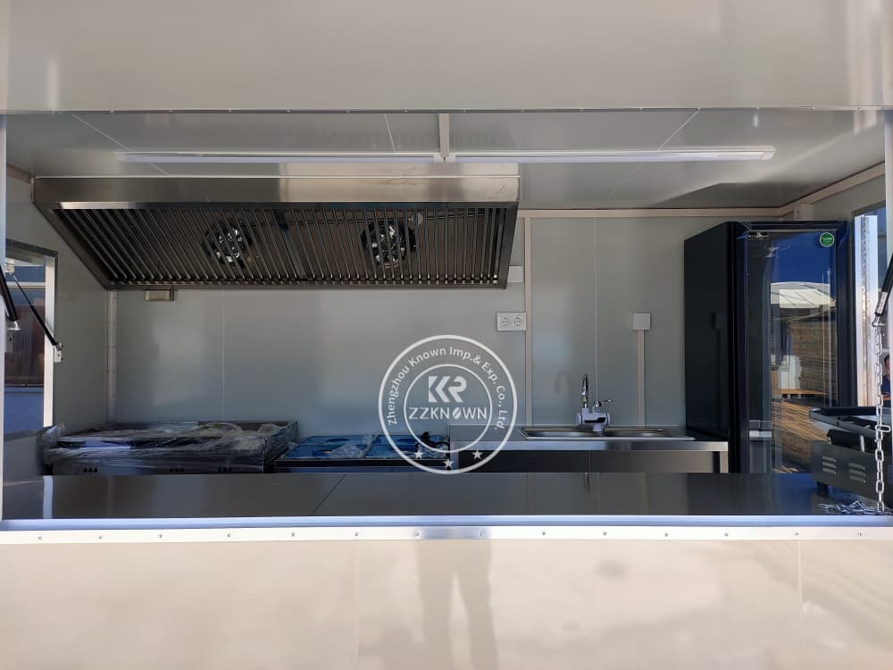 DALL·E 3 image: Inside view of trailer with 220V Euro standard outlets and connected appliances